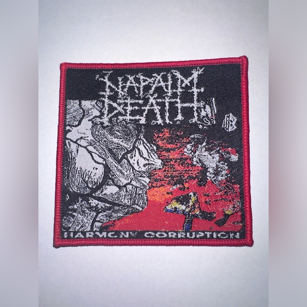 NAPALM DEATH, HARMONY CORRUPTION, RED BORDER, SEW ON WOVEN PATCH
